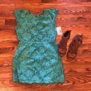 Your closet will love you! Boutique lace dress with keyhole back. Size L.